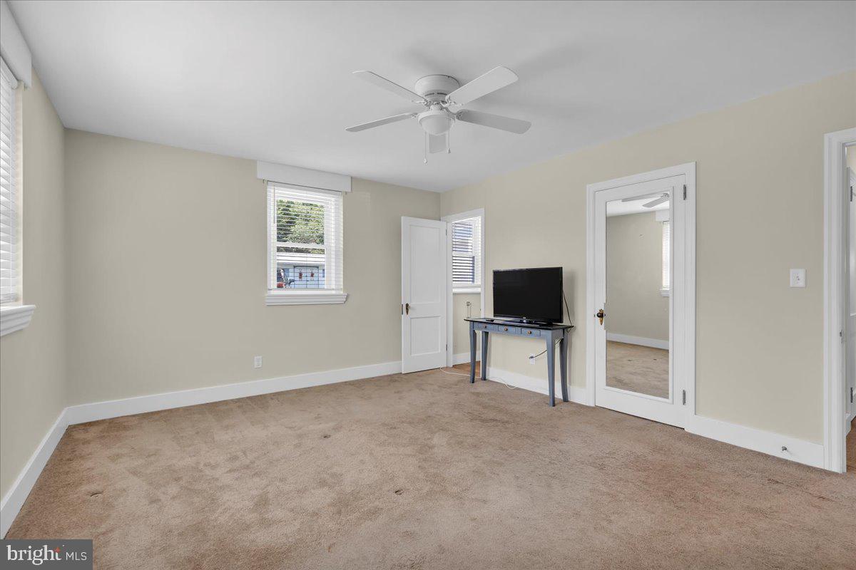 217 South Main Street Elmer, NJ 08318 - Photo 16 of 25 an empty room with windows and fan
