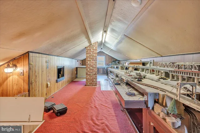 a storage & utility room with wooden floor