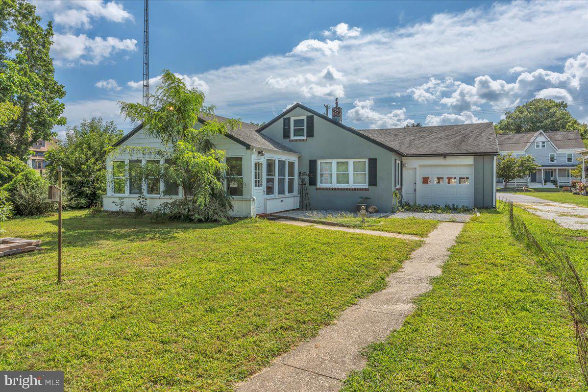 217 South Main Street Elmer, NJ 08318 - Photo 21 of 25 a front view of house with yard and green space