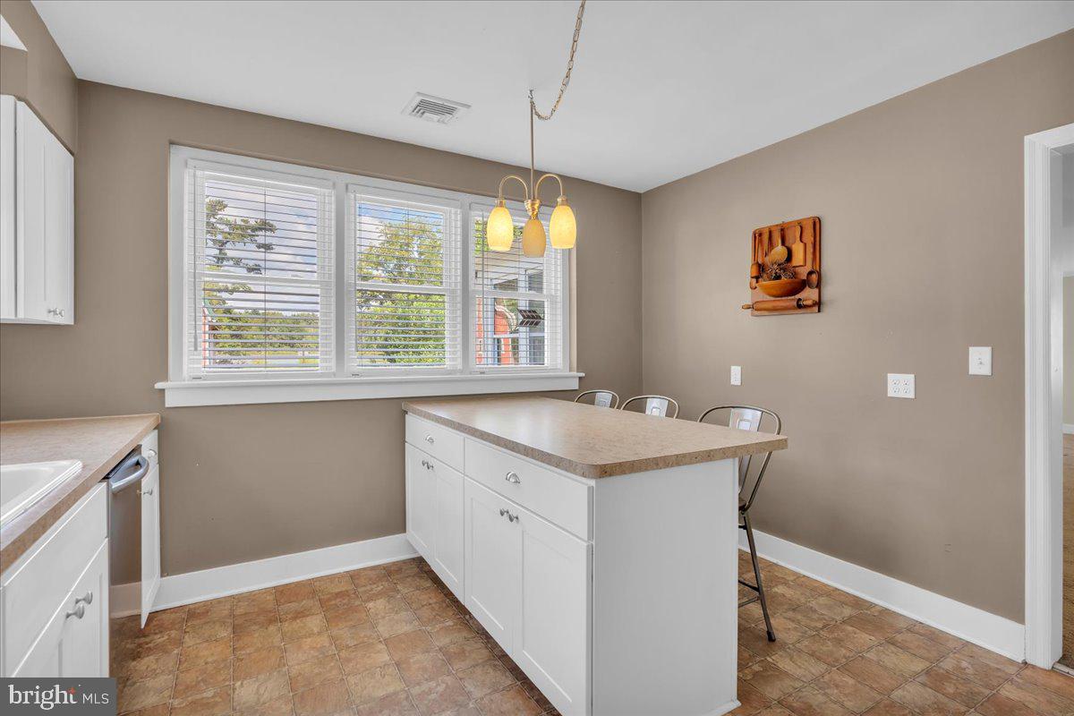 217 South Main Street Elmer, NJ 08318 - Photo 8 of 25 a view of a kitchen with a sink and a window