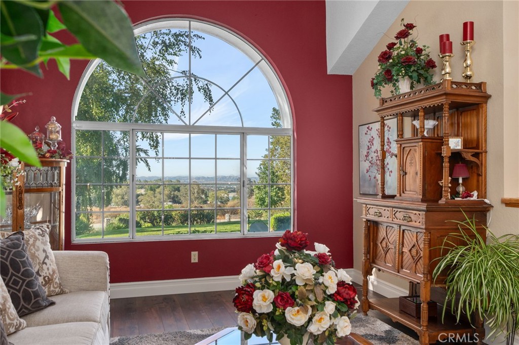 10684 Lakeview Road Yucaipa, CA 92399 - Photo 14 of 63 a living room filled with furniture and a floor to ceiling window