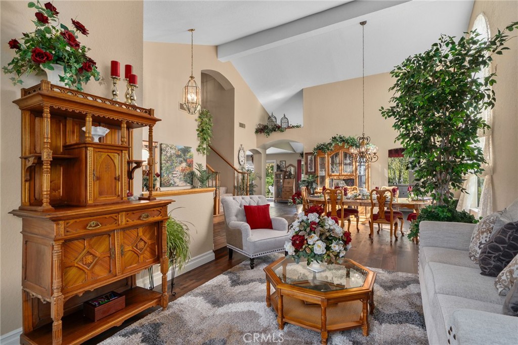 10684 Lakeview Road Yucaipa, CA 92399 - Photo 15 of 63 a living room with furniture and a chandelier