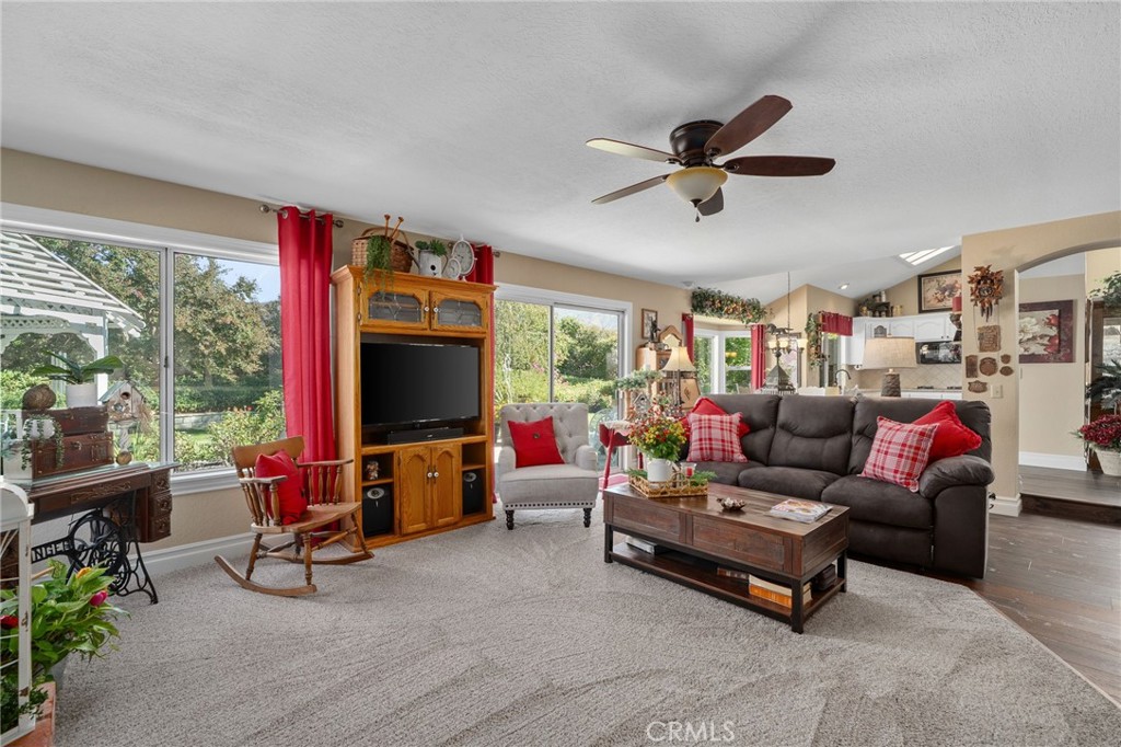 10684 Lakeview Road Yucaipa, CA 92399 - Photo 27 of 63 a living room with furniture and a flat screen tv