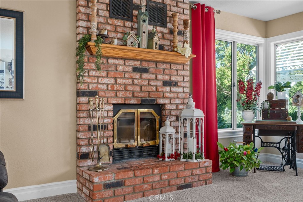 10684 Lakeview Road Yucaipa, CA 92399 - Photo 28 of 63 a living room with furniture and a fireplace