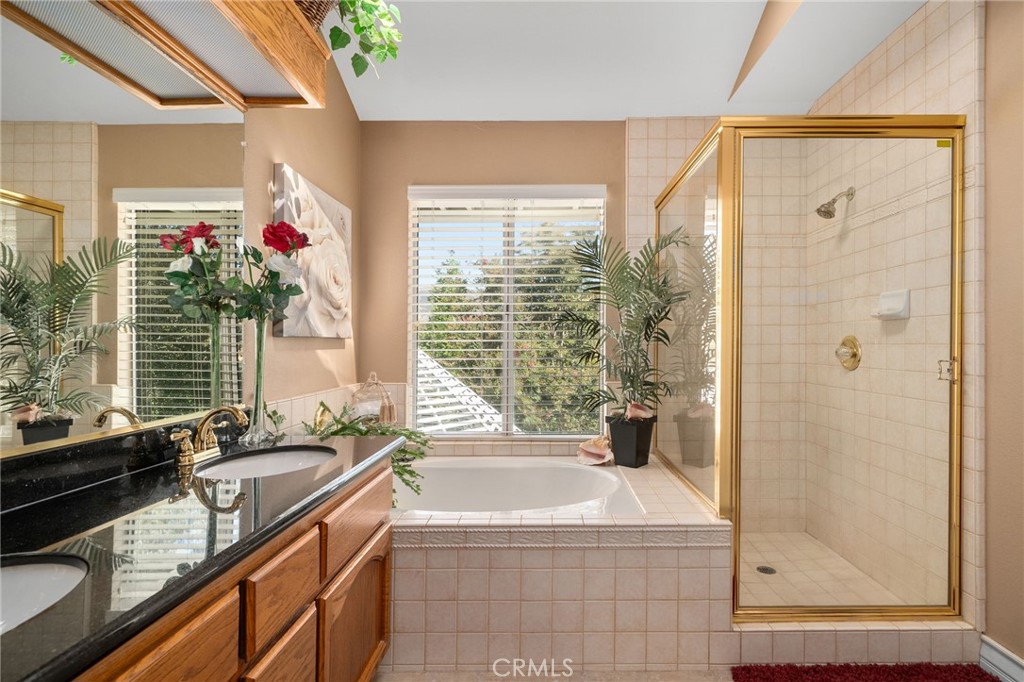 10684 Lakeview Road Yucaipa, CA 92399 - Photo 42 of 63 a bath room with a sink and a bath tub
