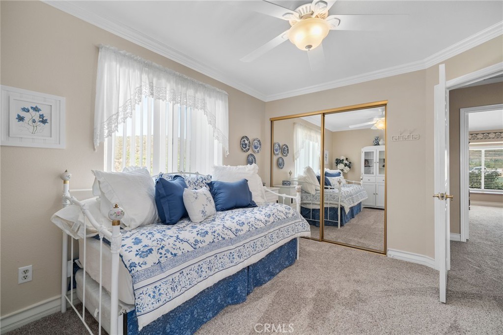 10684 Lakeview Road Yucaipa, CA 92399 - Photo 49 of 63 a living room with furniture and a chandelier
