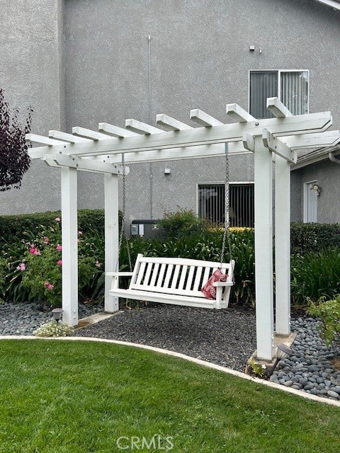10684 Lakeview Road Yucaipa, CA 92399 - Photo 57 of 63 a front view of a house with garden and seating area