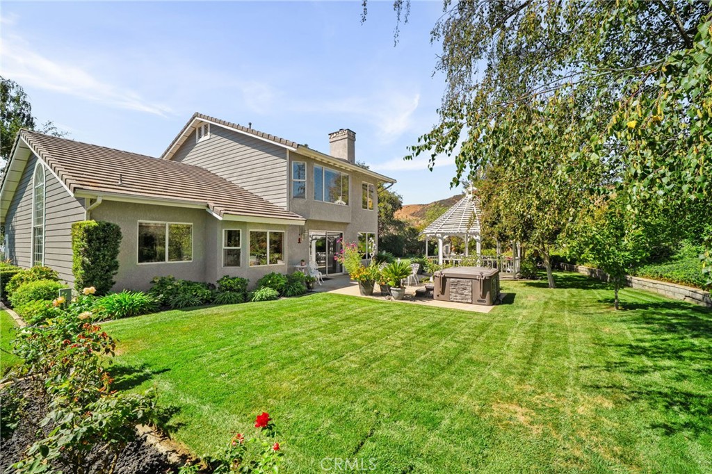 10684 Lakeview Road Yucaipa, CA 92399 - Photo 59 of 63 a view of a house with a yard porch and sitting area