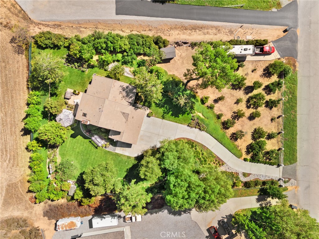10684 Lakeview Road Yucaipa, CA 92399 - Photo 62 of 63 an aerial view of a house with a yard and garden