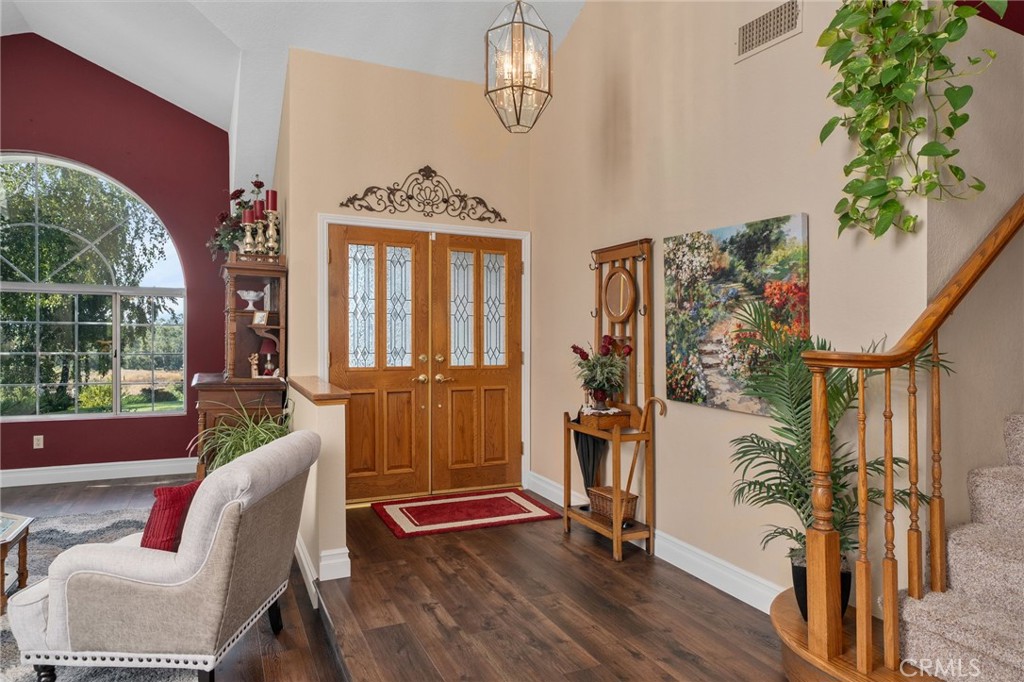 10684 Lakeview Road Yucaipa, CA 92399 - Photo 10 of 63 a living room with furniture a window and wooden floor