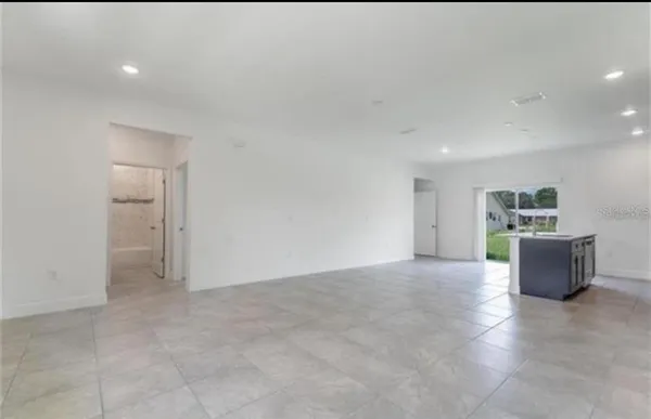 a view of a room with wooden floor and cabinet