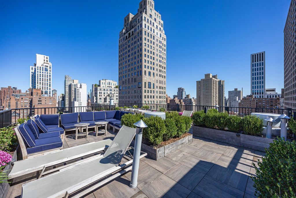 239 East 79th Street, Unit 8A Manhattan, NY 10075 - Photo 12 of 14 a view of city with tall buildings