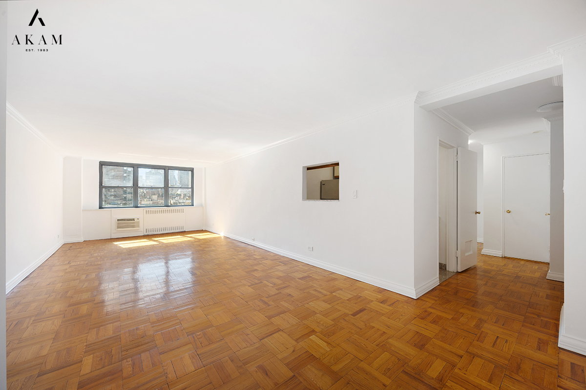 239 East 79th Street, Unit 8A Manhattan, NY 10075 - Photo 2 of 14 a view of an empty room with a window