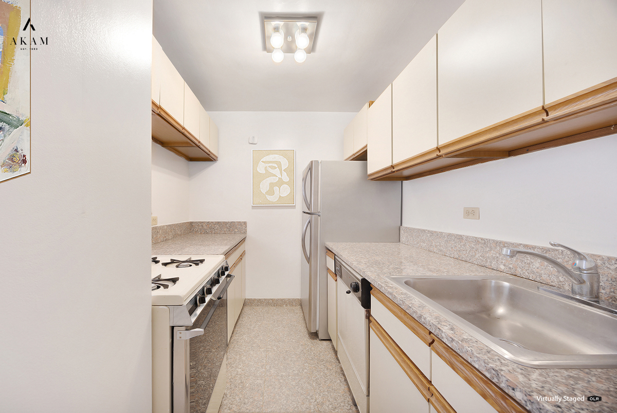 239 East 79th Street, Unit 8A Manhattan, NY 10075 - Photo 7 of 14 a kitchen with stainless steel appliances granite countertop a sink stove and refrigerator