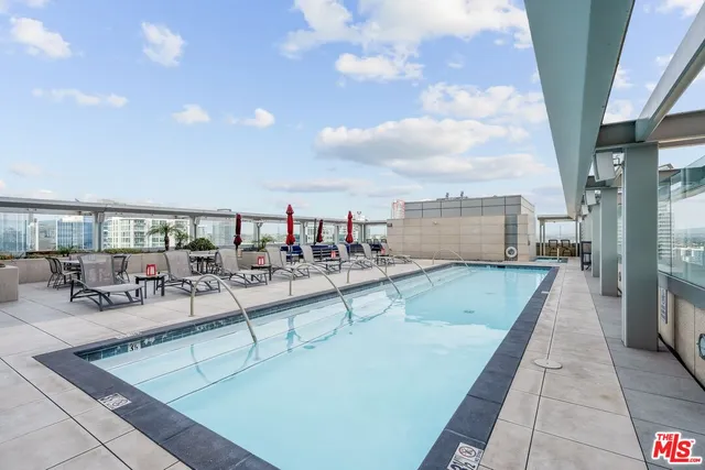 a view of a living room and kitchen