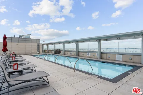 a view of a swimming pool with a porch