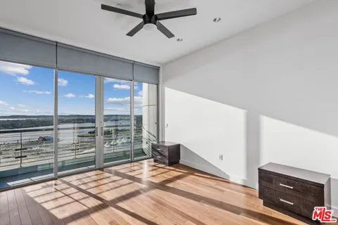a view of a living room and floor to ceiling window