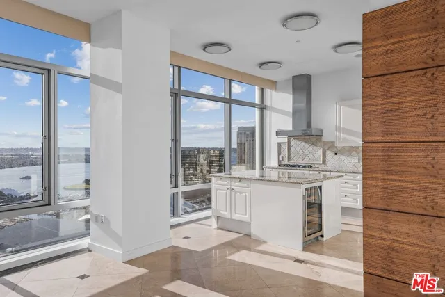 a kitchen with a stove a sink and a refrigerator