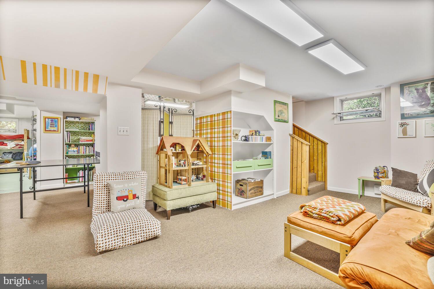 406 Pershing Drive Silver Spring, MD 20910 - Photo 15 of 27 a living room with furniture and a flat screen tv