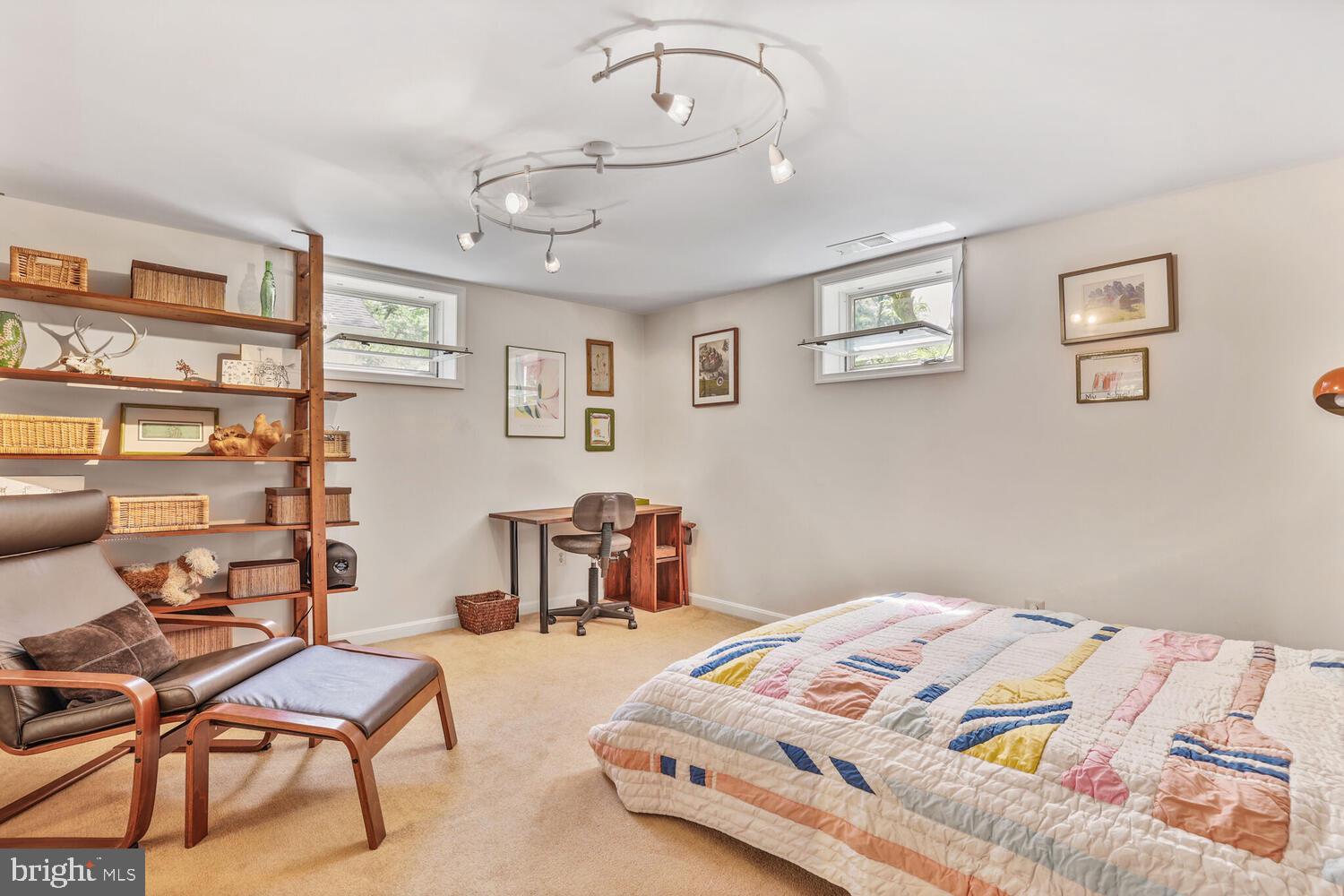 406 Pershing Drive Silver Spring, MD 20910 - Photo 17 of 27 a bedroom with a bed a table and chair