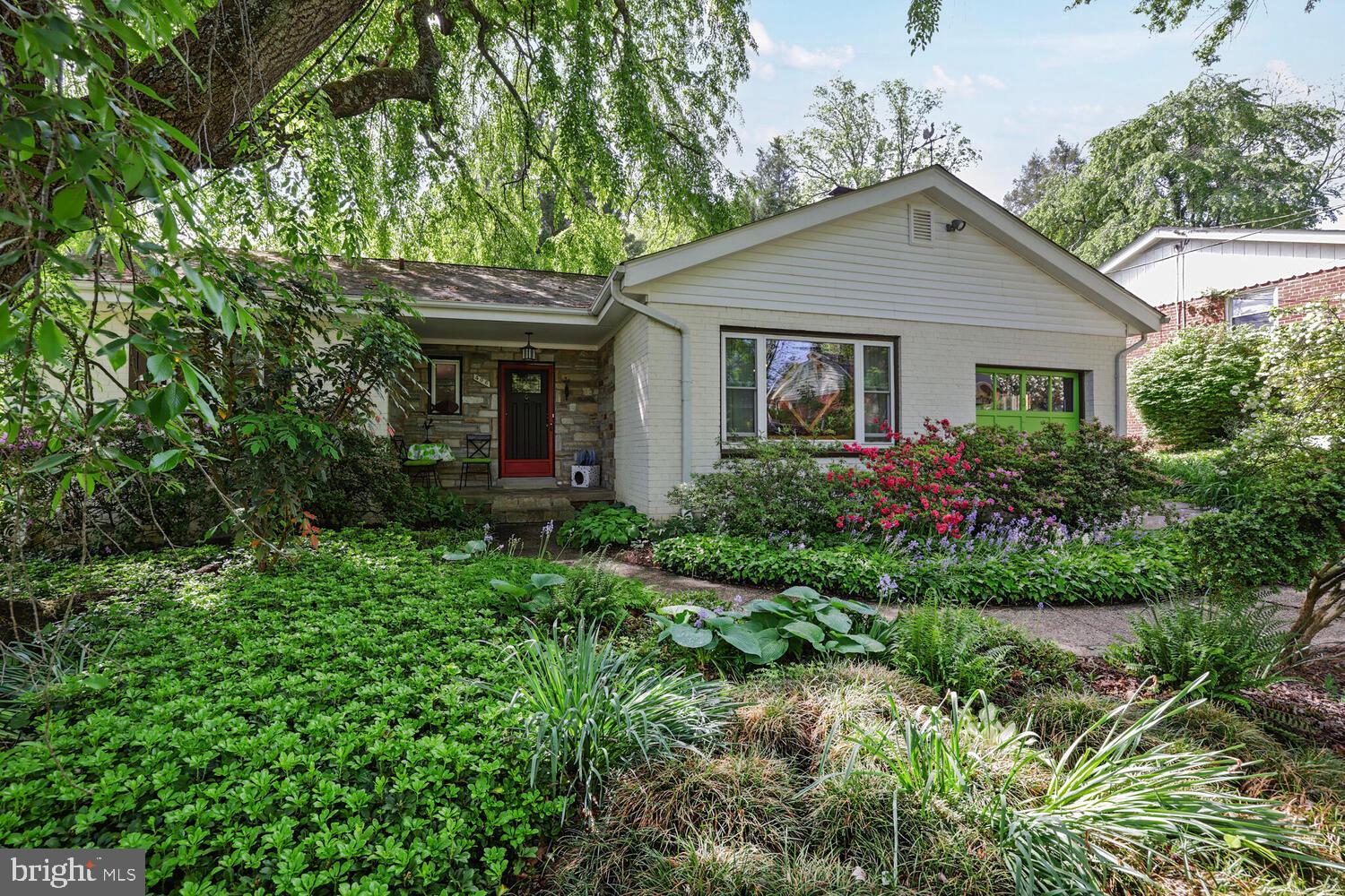 406 Pershing Drive Silver Spring, MD 20910 - Photo 2 of 27 a front view of house with a garden
