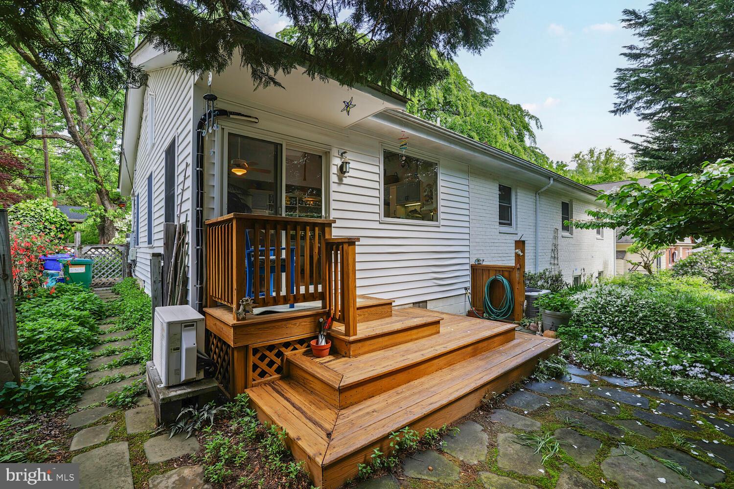 406 Pershing Drive Silver Spring, MD 20910 - Photo 21 of 27 a view of a wooden chairs in backyard of the house