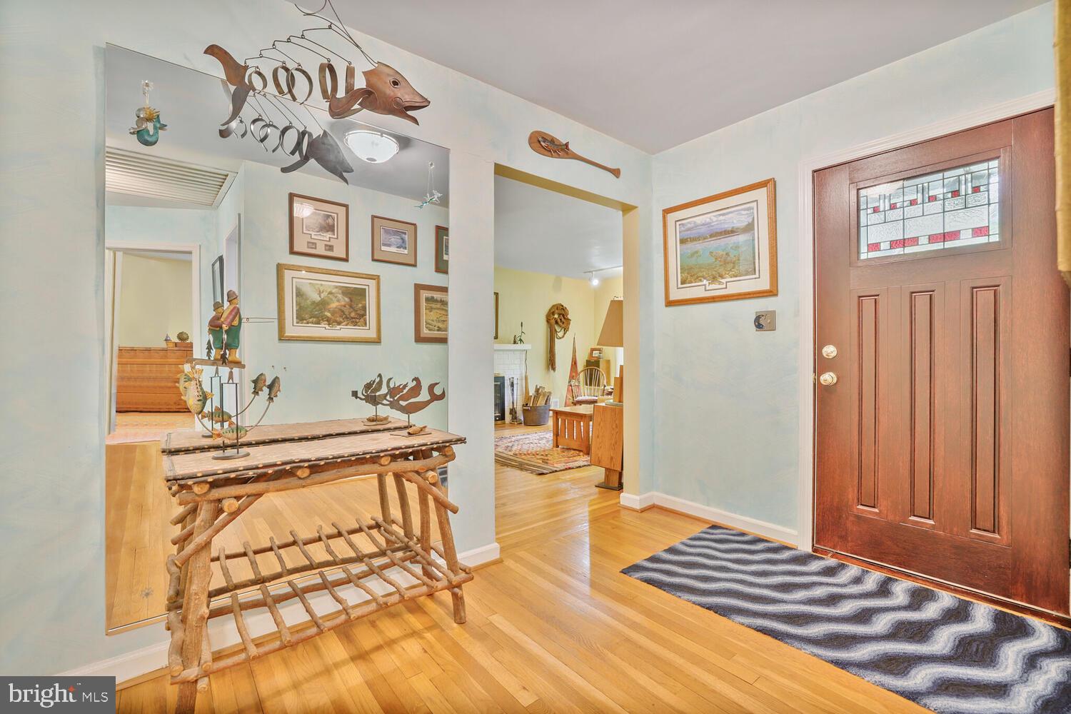 406 Pershing Drive Silver Spring, MD 20910 - Photo 3 of 27 a living room with a couch and dresser with wooden floor