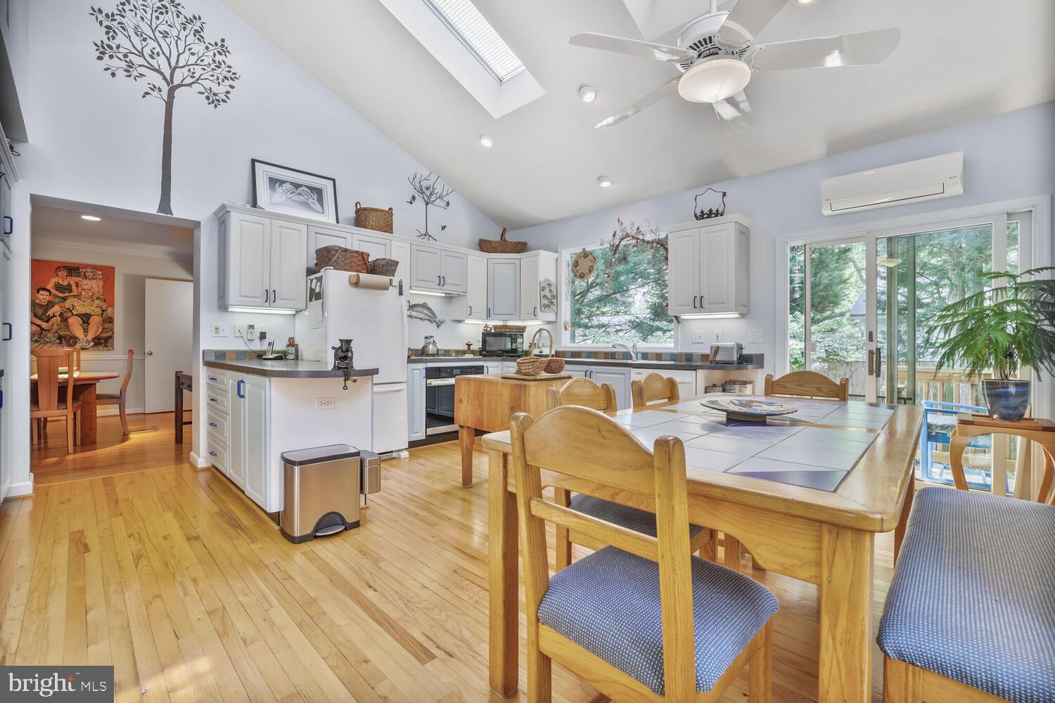 406 Pershing Drive Silver Spring, MD 20910 - Photo 5 of 27 a living room with stainless steel appliances kitchen island granite countertop furniture and a large window