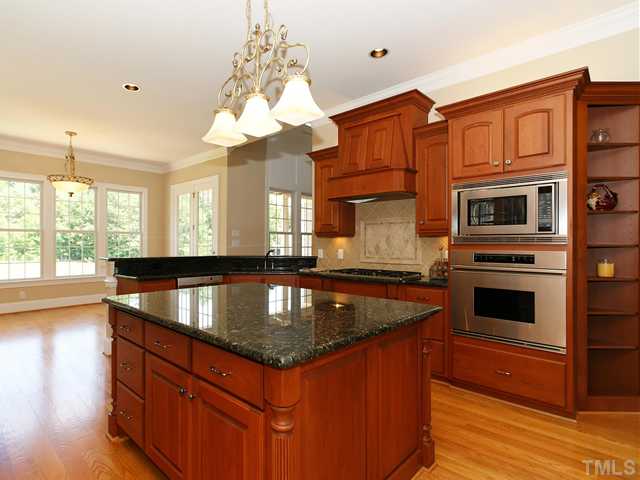 1084 Tacketts Pond Drive Raleigh, NC 27614 - Photo 8 of 25 Well designed for ease of flow. Plenty of custom cabinets!
