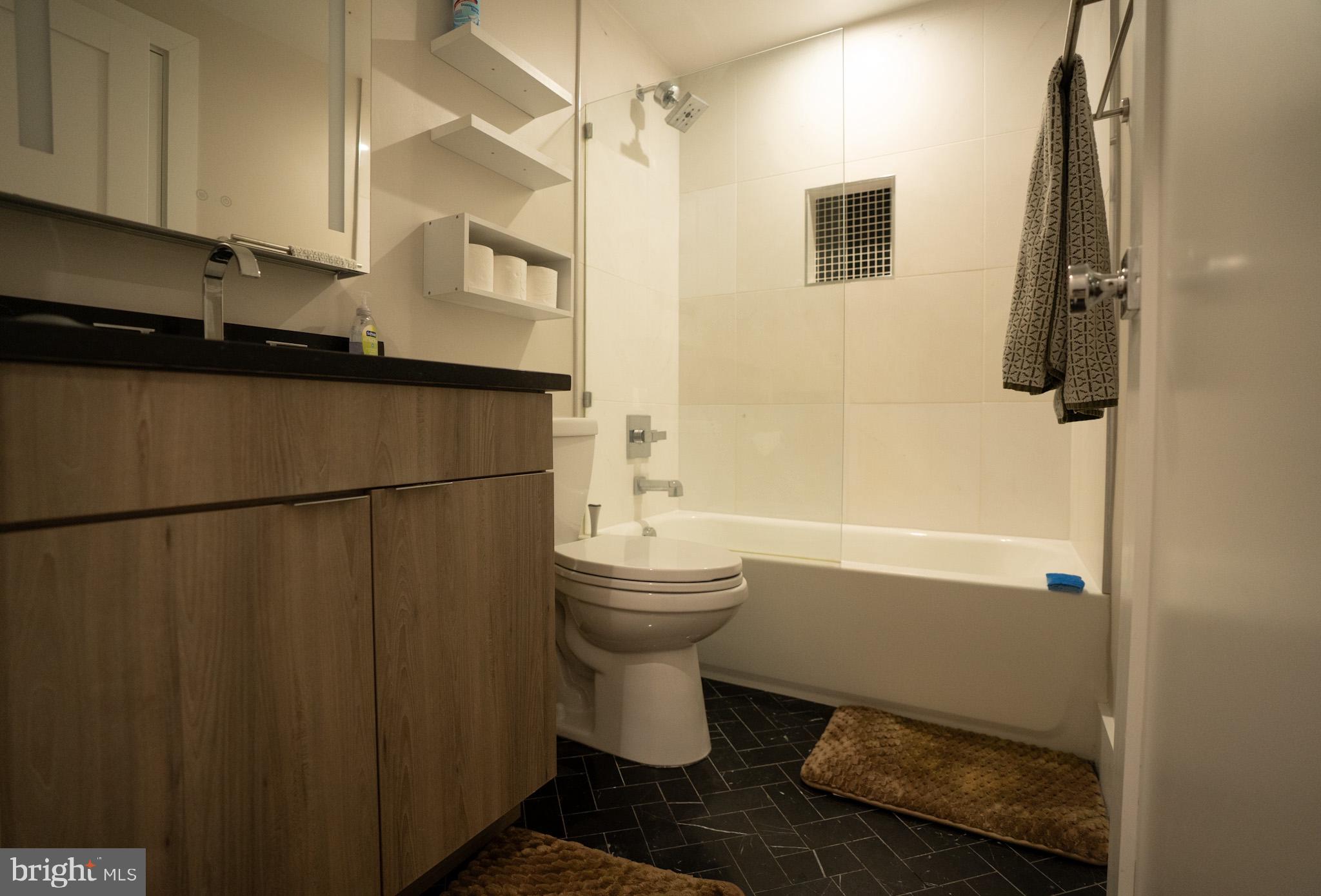 1421 Spring Road Northwest Washington, DC 20010 - Photo 12 of 12 Modern bathroom with sleek design.