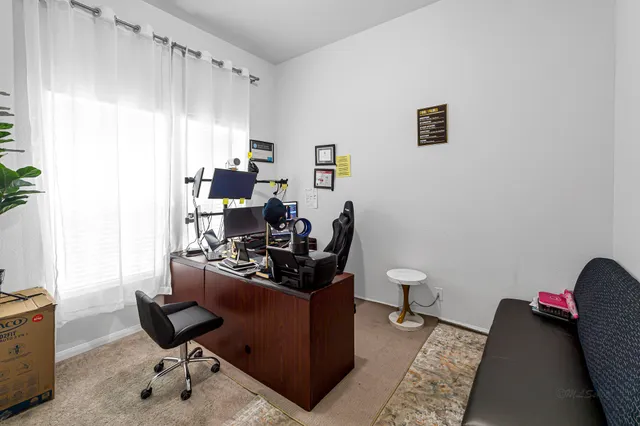 a view of a workspace with furniture