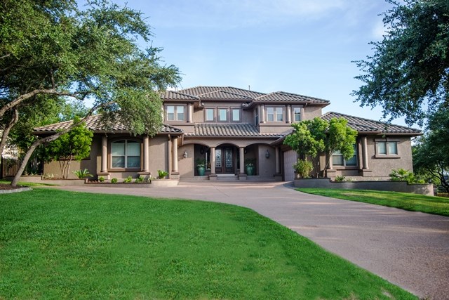 13821 Flat Top Ranch Road Austin, TX 78732 - Photo 1 of 1 a front view of a house with yard and green space