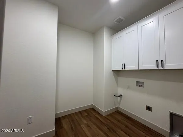 a view of a room with a fireplace and window