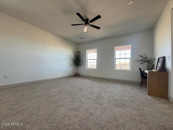 a view of an empty room and wooden floor