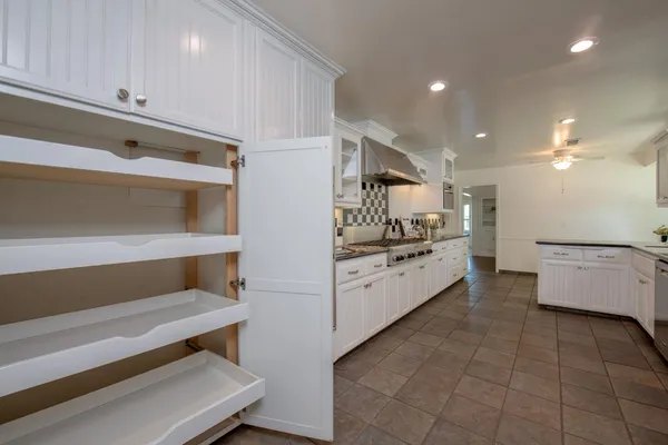 a room with a sink and cabinets