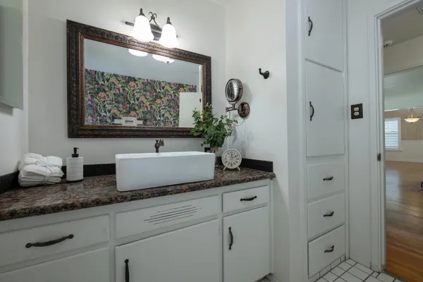 a kitchen with granite countertop a stove and a sink