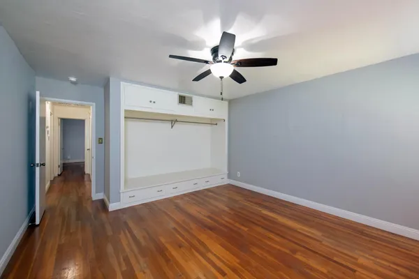 a view of living room with furniture and gym equipment