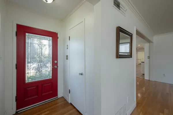 a view of an entryway with a small yard