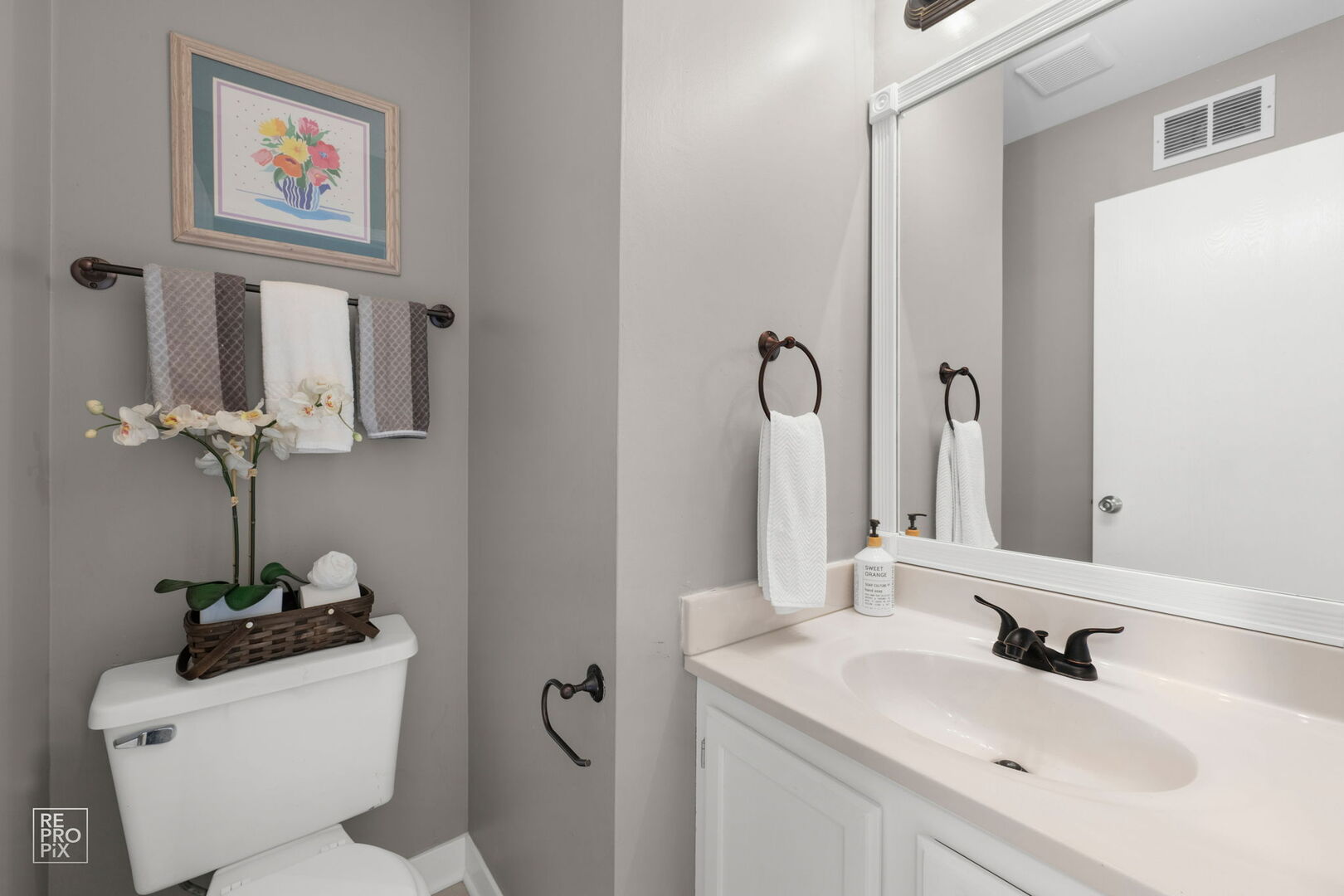 95 North Southport Road Mundelein, IL 60060 - Photo 15 of 26 a bathroom with a toilet sink and mirror