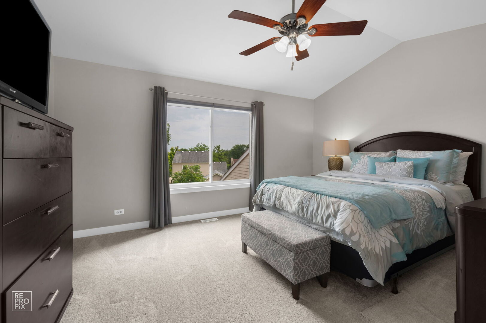 95 North Southport Road Mundelein, IL 60060 - Photo 16 of 26 a spacious bedroom with a bed and a flat screen tv