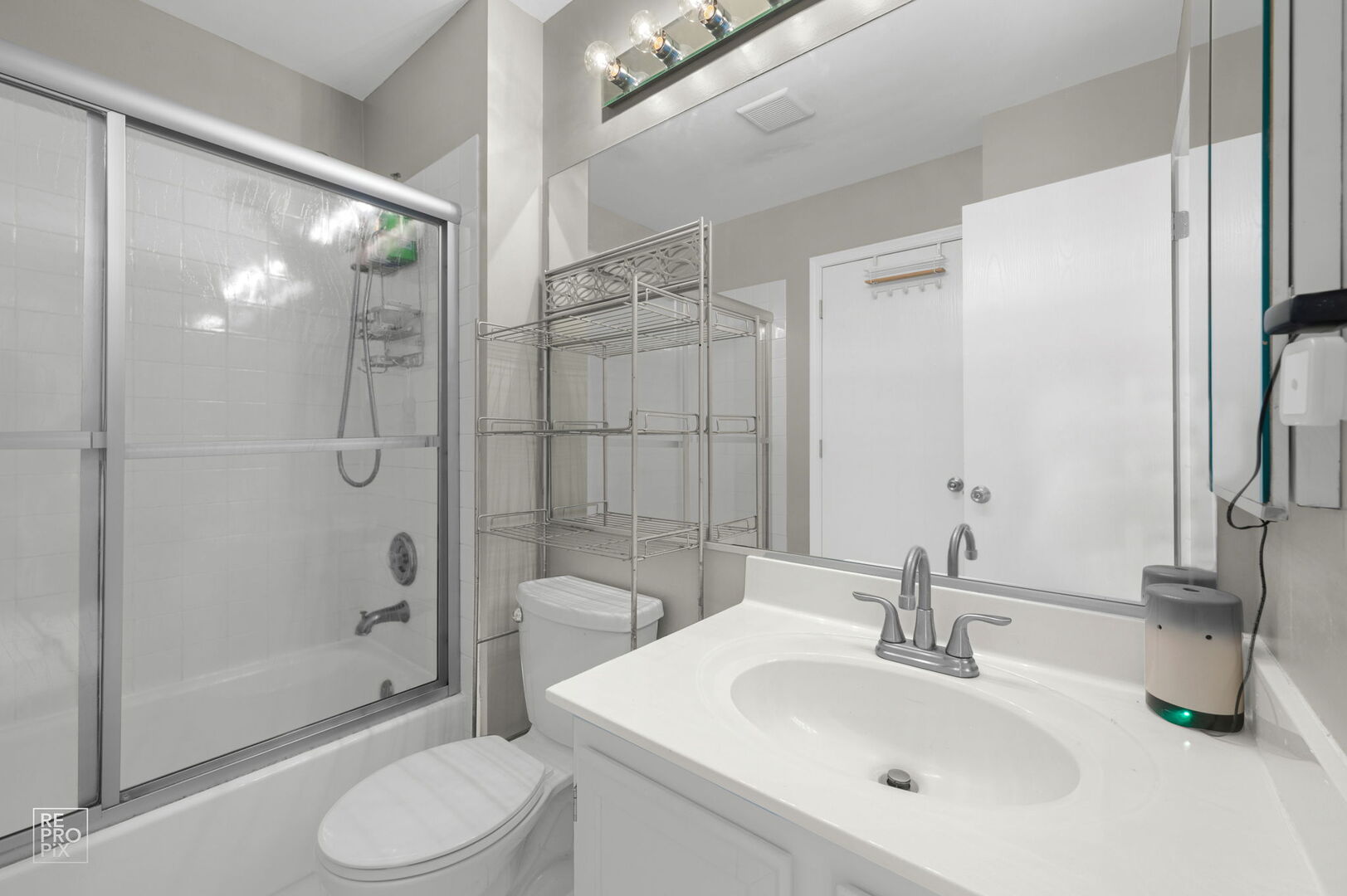 95 North Southport Road Mundelein, IL 60060 - Photo 19 of 26 a bathroom with a sink toilet and shower
