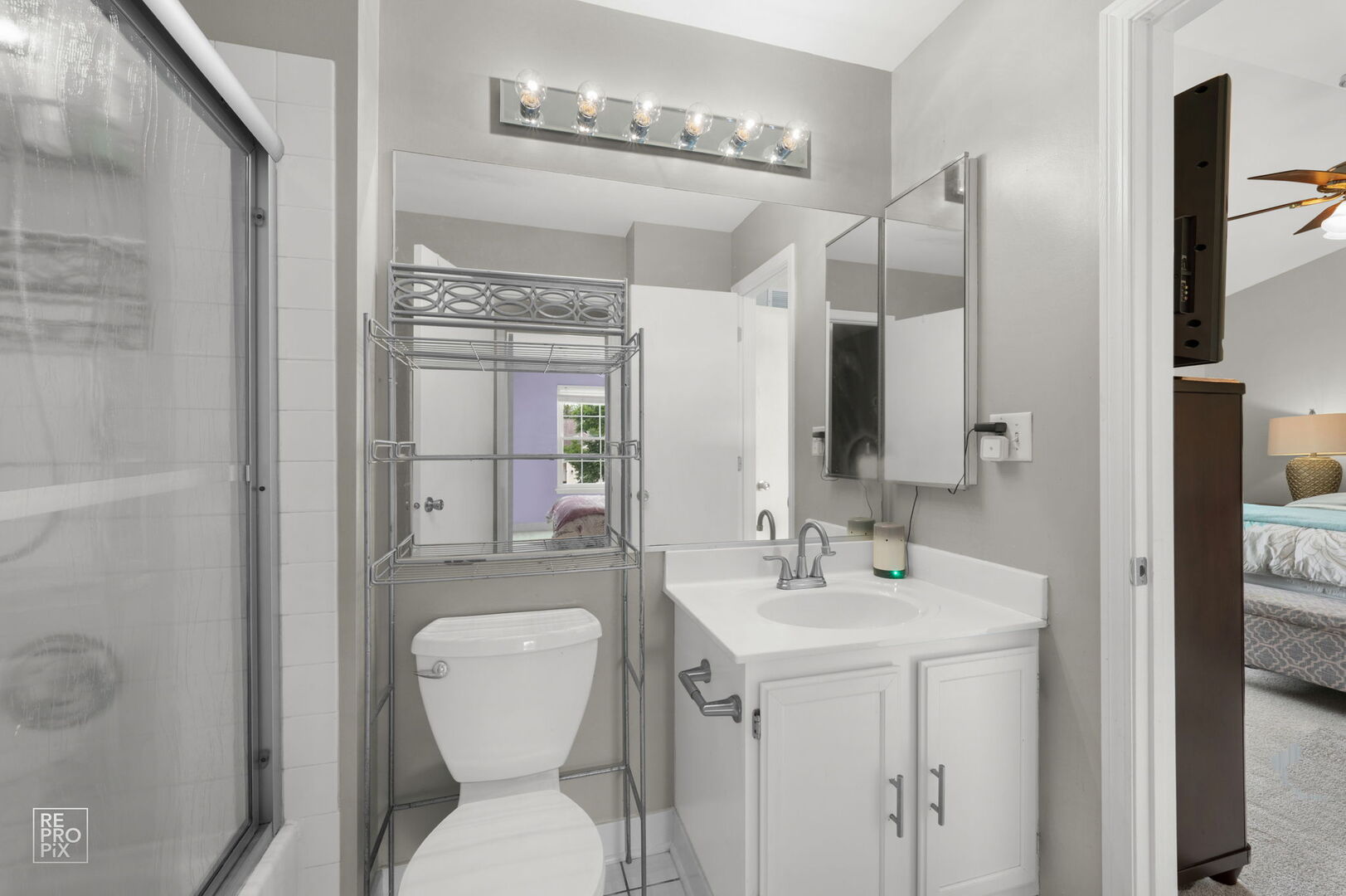 95 North Southport Road Mundelein, IL 60060 - Photo 20 of 26 a bathroom with a sink a toilet and mirror
