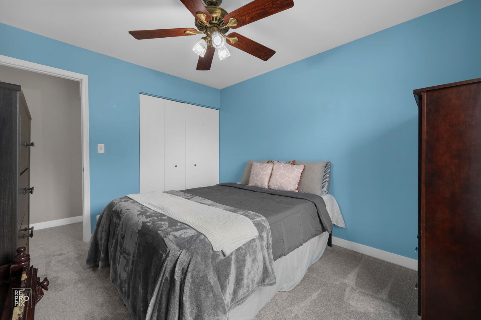 95 North Southport Road Mundelein, IL 60060 - Photo 24 of 26 a bed room with a bed and a ceiling fan