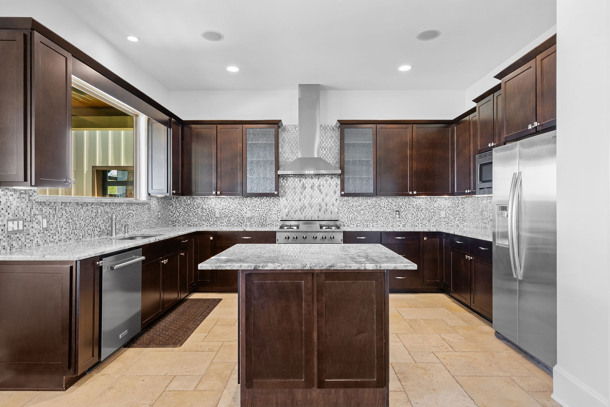 1124 County Road 301 Elgin, TX 78621 - Photo 15 of 40 a kitchen with stainless steel appliances kitchen island granite countertop a sink and a stove