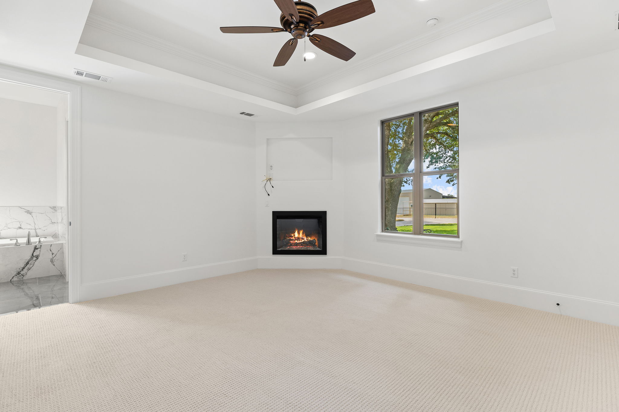 1124 County Road 301 Elgin, TX 78621 - Photo 17 of 40 an empty room with windows and ceiling fan