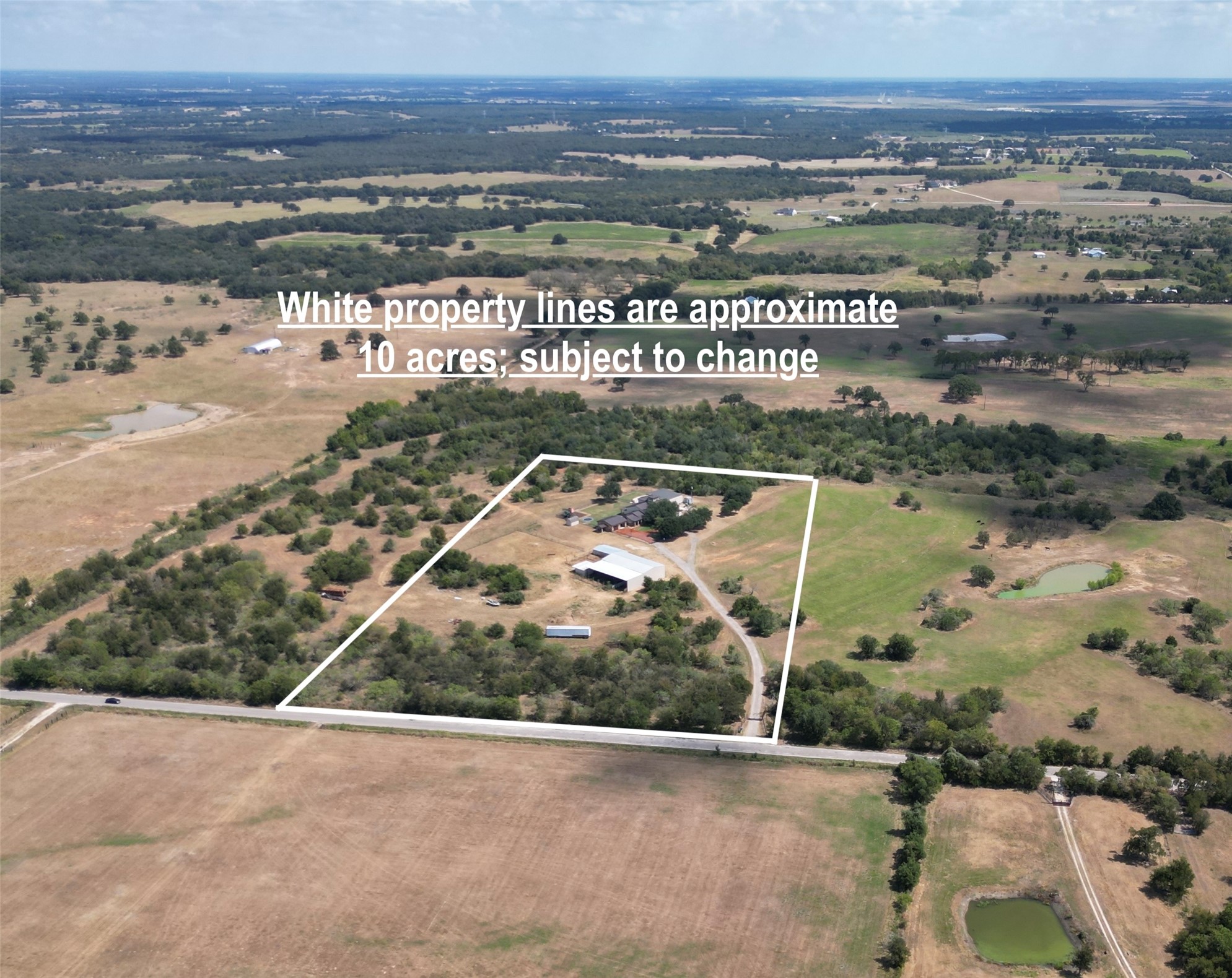 1124 County Road 301 Elgin, TX 78621 - Photo 3 of 40 an aerial view of a city