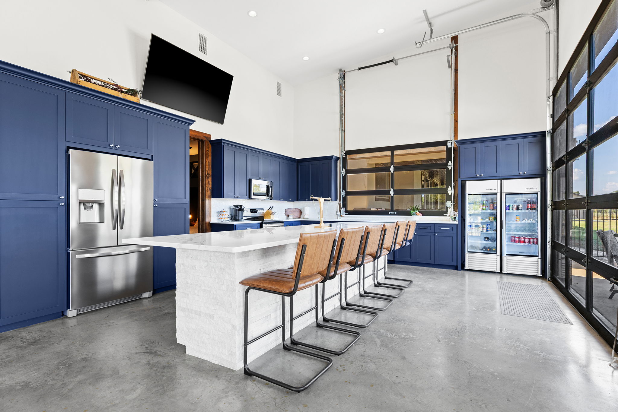 1124 County Road 301 Elgin, TX 78621 - Photo 31 of 40 a living room with stainless steel appliances furniture a flat screen tv and kitchen view