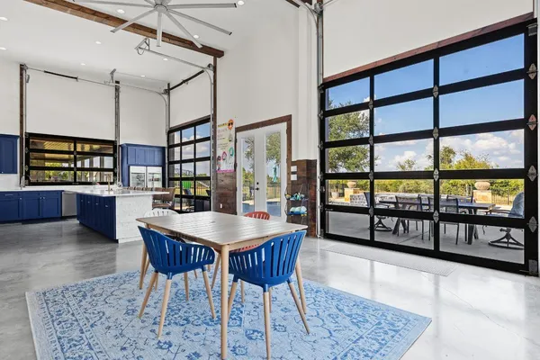 a dining area with a table and chairs