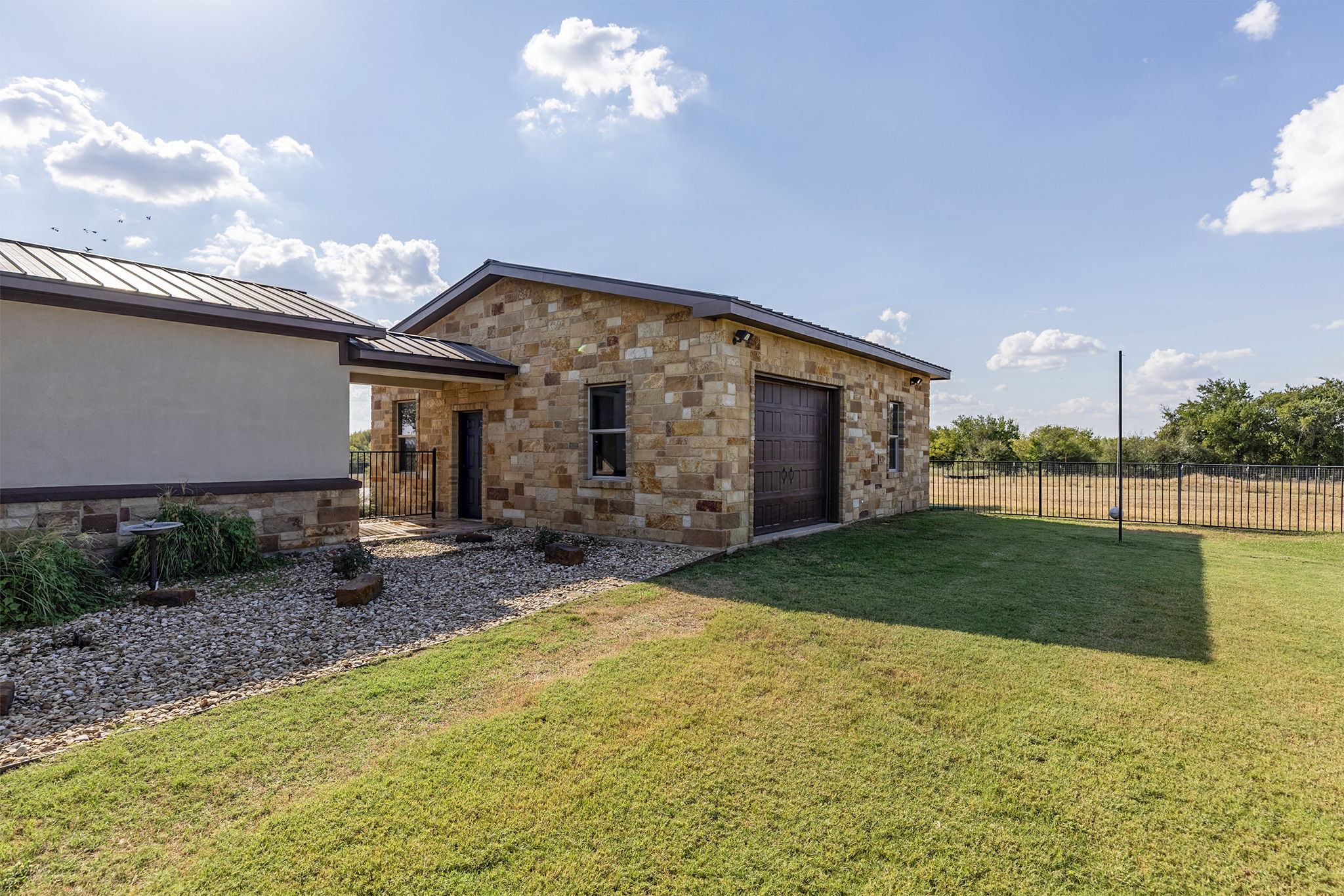 1124 County Road 301 Elgin, TX 78621 - Photo 38 of 40 a view of a house with backyard and sitting area