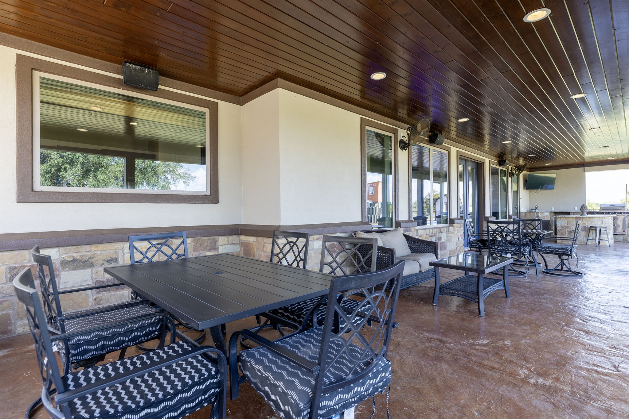 1124 County Road 301 Elgin, TX 78621 - Photo 6 of 40 an outdoor sitting area with furniture and wooden floor